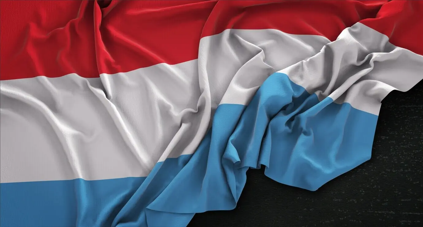 3D render of the wrinkled Luxembourg flag on a dark background.